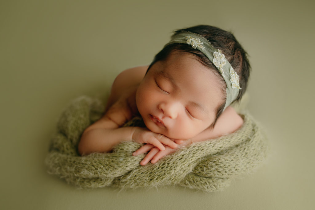 Newborn Baby Girl Posed Head on Hands Photography